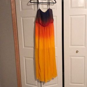 long flowy dress with ombré sunset coloring to it